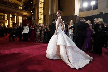 Best Actress nominee Jennifer Lawrence for her role in "Silver Linings Playbook", wearing a white Dior Haute Couture gown, poses at the 85th Academy Awards in Hollywood, California in this February 24, 2013 file photo. REUTERS/Lucy Nicholson/Files
