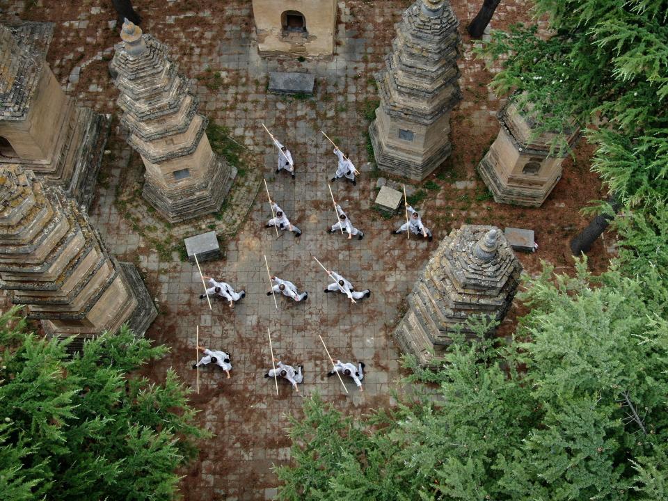 Aerial photo taken on July 8, 2021 shows Shaolin monks practicing martial arts at Shaolin Temple