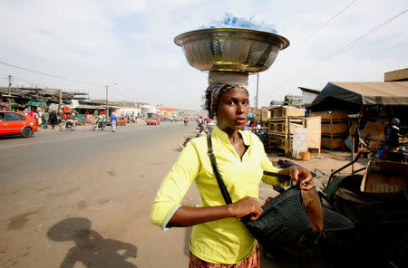 A woman looks on in a street after the city was taken last week by mutinous soldiers, in Bouake, Ivory Coast January 13, 2017. REUTERS/Thierry Gouegnon