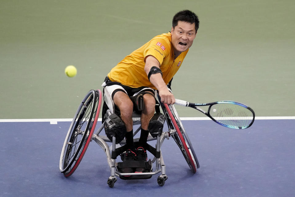 FILE - Shingo Kunieda, of Japan, returns a shot to Alfie Hewett, of Britain, during the men's wheelchair singles final of the U.S. Open tennis championships on Sept. 11, 2022, in New York. Kunieda, the most successful player in the history of wheelchair tennis, announced his retirement from the sport on Sunday, Jan. 22, 2023, at the age of 38. (AP Photo/Mary Altaffer, File)