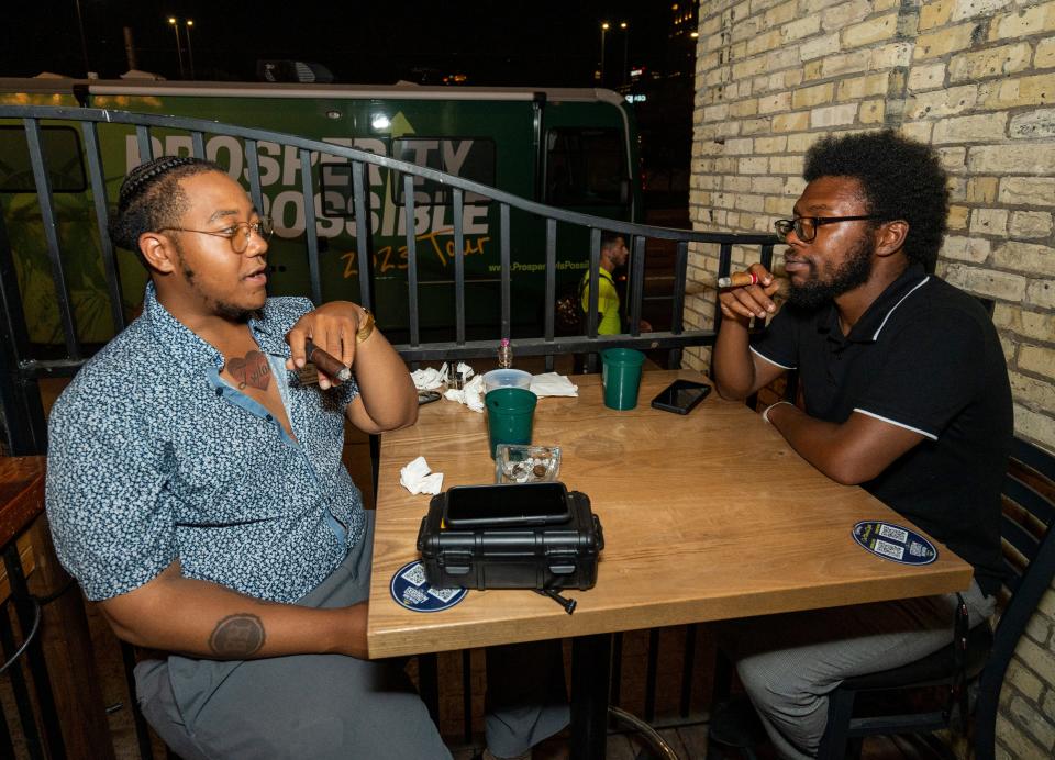 (Left) Jamiroquan Kittler, Supervisor of Grassroots Operation for Americans for Prosperity, and (right) Reginald Boone of Milwaukee discuss the Republican Presidential Primary Debate at a watch party hosted by Americans for Prosperity Wisconsin at The Explorium Brewpub on Wednesday August 23, 2023 in Milwaukee, Wis.