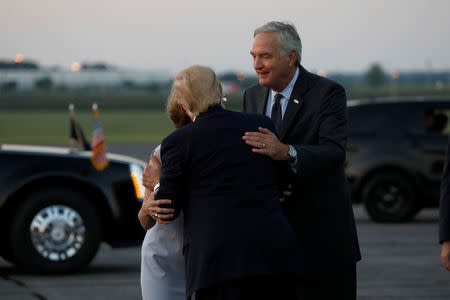 President Donald Trump greets Sen. Luther Strange (R-AL) and his wife Melissa as he arrives at Huntsville International Airport in Huntsville, Alabama, September 22, 2017. REUTERS/Aaron P. Bernstein