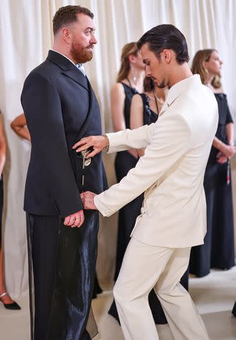 <p>Mike Coppola/MG24/Getty</p> Sam Smith and Christian Cowan attend The 2024 Met Gala Celebrating "Sleeping Beauties: Reawakening Fashion" on May 06, 2024 in New York City.