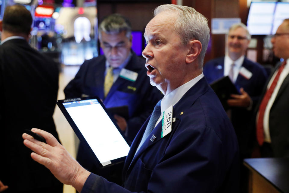 Traders work on the floor of the New York Stock Exchange shortly after the opening bell in New York City, U.S., November 21, 2019.  REUTERS/Lucas Jackson