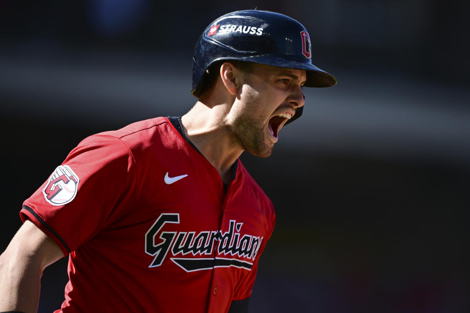 Cleveland Guardians' Lane Thomas shouts as he runs the bases after hitting a home run in the first inning during Game 1 of baseball's AL Division Series against the Detroit Tigers, Saturday, Oct. 5, 2024, in Cleveland. (AP Photo/David Dermer)