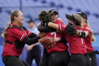 Canada's Danielle Lawrie, center right, celebrate with teammates after a softball game against Mexico at the 2020 Summer Olympics, Tuesday, July 27, 2021, in Yokohama, Japan. Canada won 3-2. (AP Photo/Sue Ogrocki)