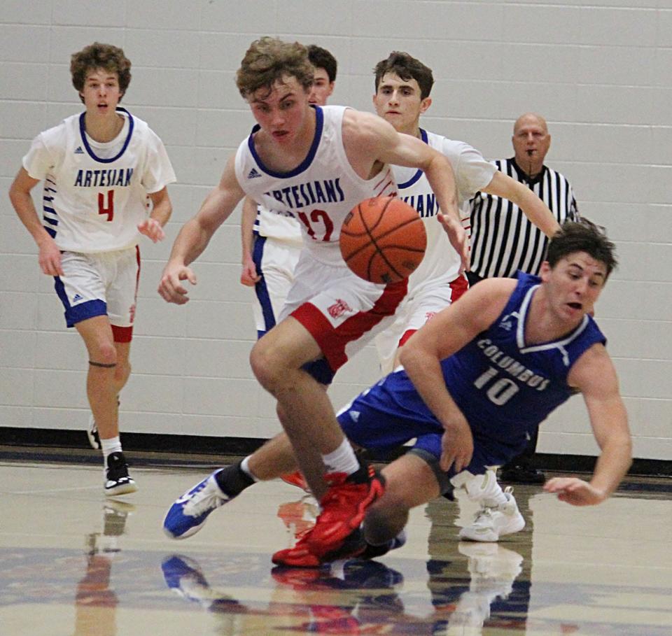 Martinsville junior Will Bastin gets a steal late in Saturday's game at home against Columbus North.