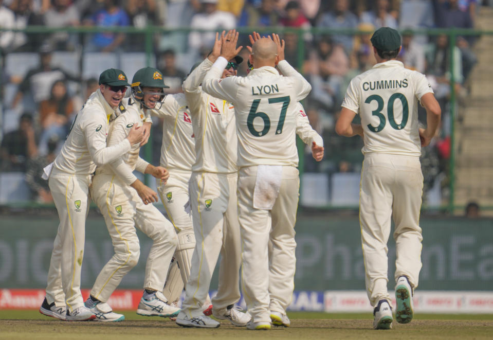 Australia's Nathan Lyon, second right without cap, celebrates with teammates the dismissal of India's Shreyas Iyer during the second day of the second cricket test match between India and Australia in New Delhi, India, Saturday, Feb. 18, 2023. (AP Photo/Altaf Qadri)