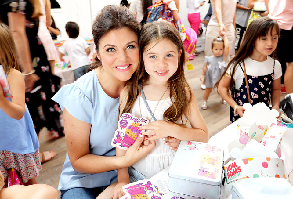 <p>The <i>Saved by the Bell</i> alum and her cute 7-year-old daughter, Harper, got crafty, decorating lunch boxes at a Num Noms event the actress hosted at Au Fudge in West Hollywood. The guest list included Thiessen’s former co-stars Mario Lopez and Ian Ziering. (Photo: Rachel Murray/Getty Images for Num Noms) </p>