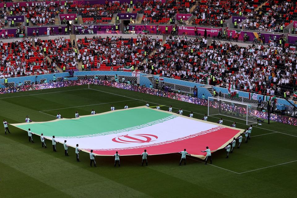 A giant flag of IR Iran on the pitch prior to the FIFA World Cup Qatar 2022 Group B match between Wales and IR Iran at Ahmad Bin Ali Stadium on November 25, 2022 in Doha, Qatar.