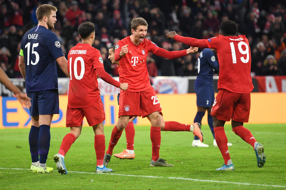 MUNICH, GERMANY - DECEMBER 11: Thomas Muller of FC Bayern Munich (C) celebrates after scoring his team's second goal with Alphonso Davies during the UEFA Champions League group B match between Bayern Muenchen and Tottenham Hotspur at Allianz Arena on December 11, 2019 in Munich, Germany. (Photo by Michael Regan/Getty Images)