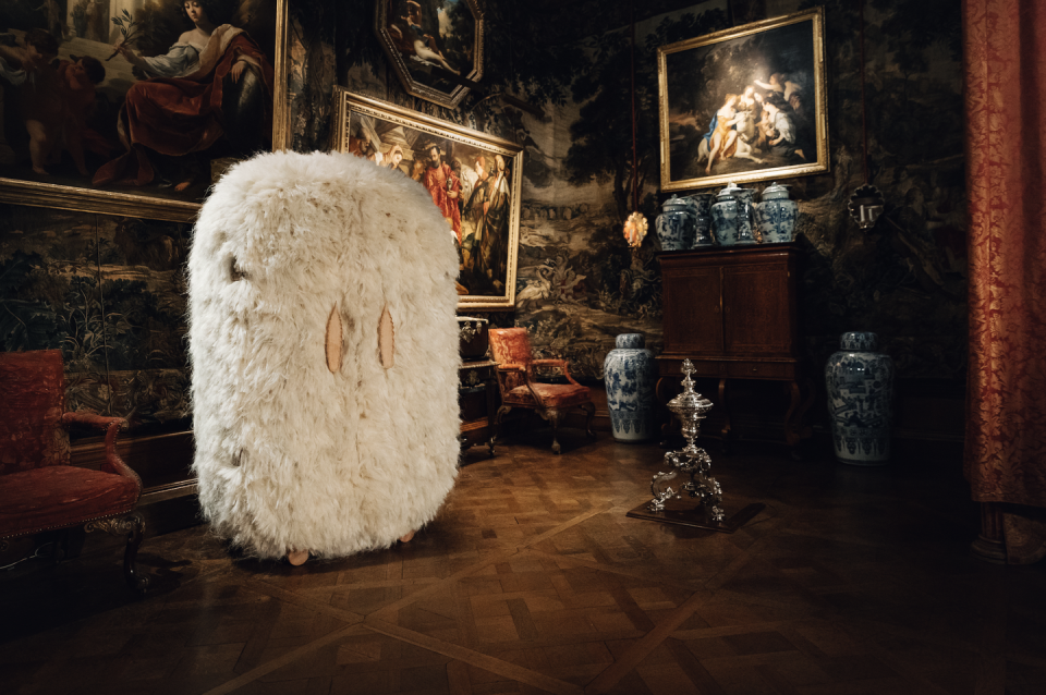 a white fuzzy cabinet in a historic mansion