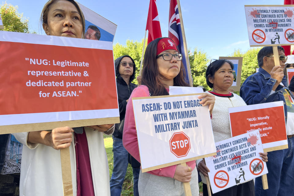 Demonstrators hold placards protesting outside the ASEAN Special Summit in Melbourne, Australia, Monday, March 4, 2024.The small group of members of the Myanmar community held a protest urging ASEAN not to support Myanmar's government. (AP Photo/Johnson Lai)