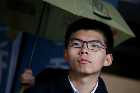 Former student leader Joshua Wong reacts outside High Court before receiving his sentence in Hong Kong, China January 17, 2018. REUTERS/Bobby Yip