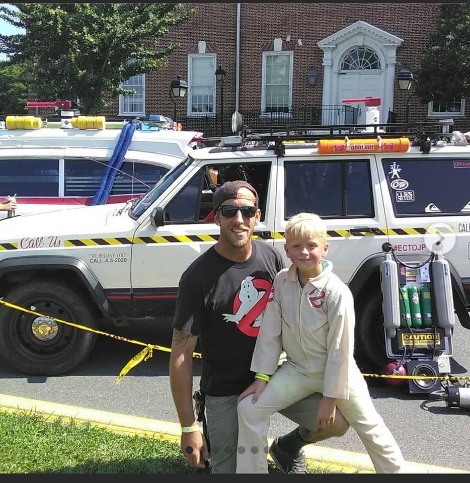 Jamie Kupidlowski, left, with his son Jakoby, in Ghostbusters clothing. The two "were obsessive" about the movie, 13-year-old Jakoby said.