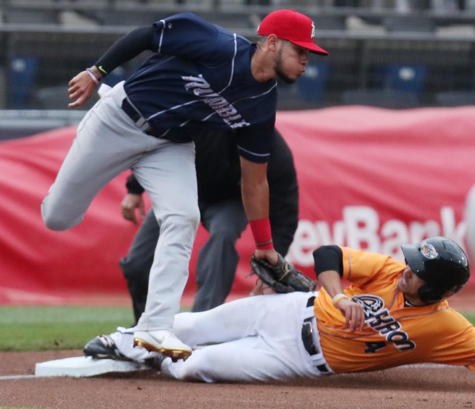 RubberDucks Steven Kwan safely steals third as Binghamton Rumble Ponies Edgardo Fermin applies a late tag in the first inning of their game at Canal Park in Akron on Thursday May 6, 2021. The Ducks beat the Rumble Ponies 9 to 2.