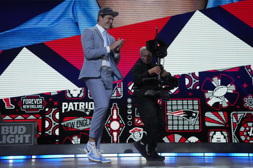 North Carolina quarterback Drake Maye celebrates after being chosen by the New England Patriots with the third overall pick during the first round of the NFL football draft, Thursday, April 25, 2024, in Detroit. (AP Photo/Jeff Roberson)