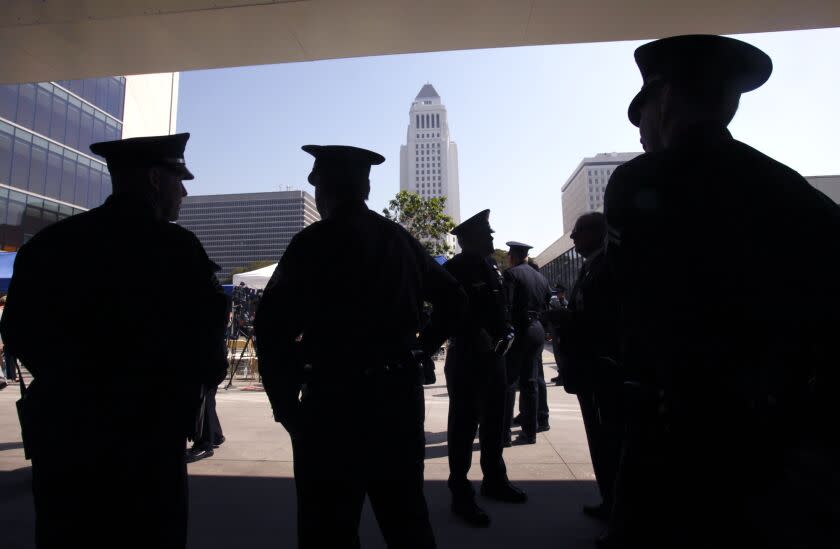 Boster, Mark –– B581251585Z.1 LOS ANGELES, CA. MAY 5, 2011: LAPD officers gather for the annual Los Angeles Police Memorial Ceremony at the LAPD Administration Building in downtown Los Angeles May 5, 2011. The LAPD honors the officers killed in the line of duty during a ceremony that includes a traditional "roll call" of fallen heroes, a 21–gun salute, missing man formation of helicopters, riderless horse, and buglers playing taps. This year two more officers were included in the ceremony, LAPD officers Joshua Cullins and R.J. Cottle who were killed during active military service in Afghanistan(Mark Boster/Los Angeles Times).