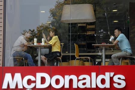 People consume their meals at McDonald's restaurant in Ho Chi Minh City March 9, 2015 REUTERS/Kham