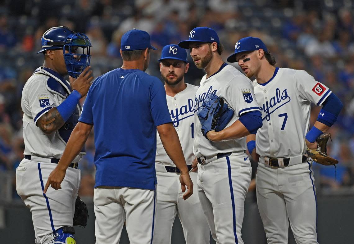 Kansas City Royals starting pitcher Alec Marsh (48) talks with Kansas City Royals pitching coach Brian Sweeney (left) in the third inning against the Detroit Tigers at Kauffman Stadium on Sept. 18, 2024.