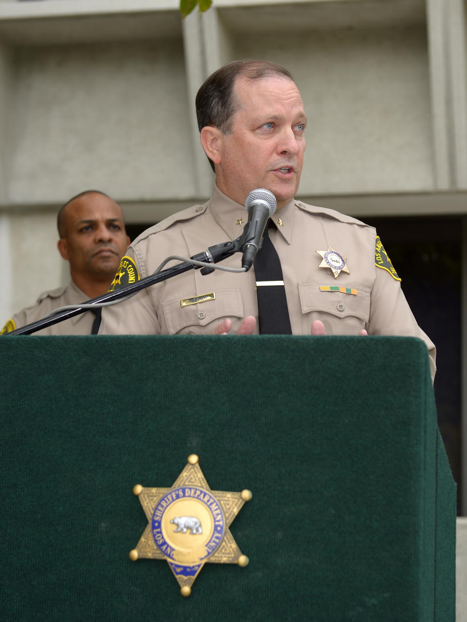 Los Angeles Sheriff's Department commander Mike Parker, right, speaks during a news conference as Capt. Roosevelt Johnson looks on, Tuesday, March 25, 2014, in Los Angeles, about the death of actor Paul Walker and his friend Roger Rodas. The Porsche carrying "Fast & Furious" star Walker was traveling up to 94 mph when it went out of control on a suburban street and crashed, killing the actor and his friend, according to an investigation by law enforcement agencies into the November accident. The sports car driven by Rodas slammed into a light pole with a 45 mph speed limit sign and burst into flames. Walker and Rodas died at the scene. (AP Photo/Mark J. Terrill)