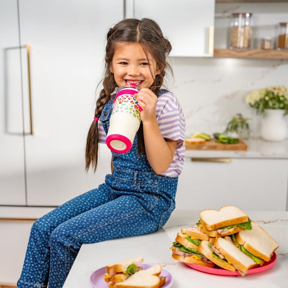 a model drinking from the cup