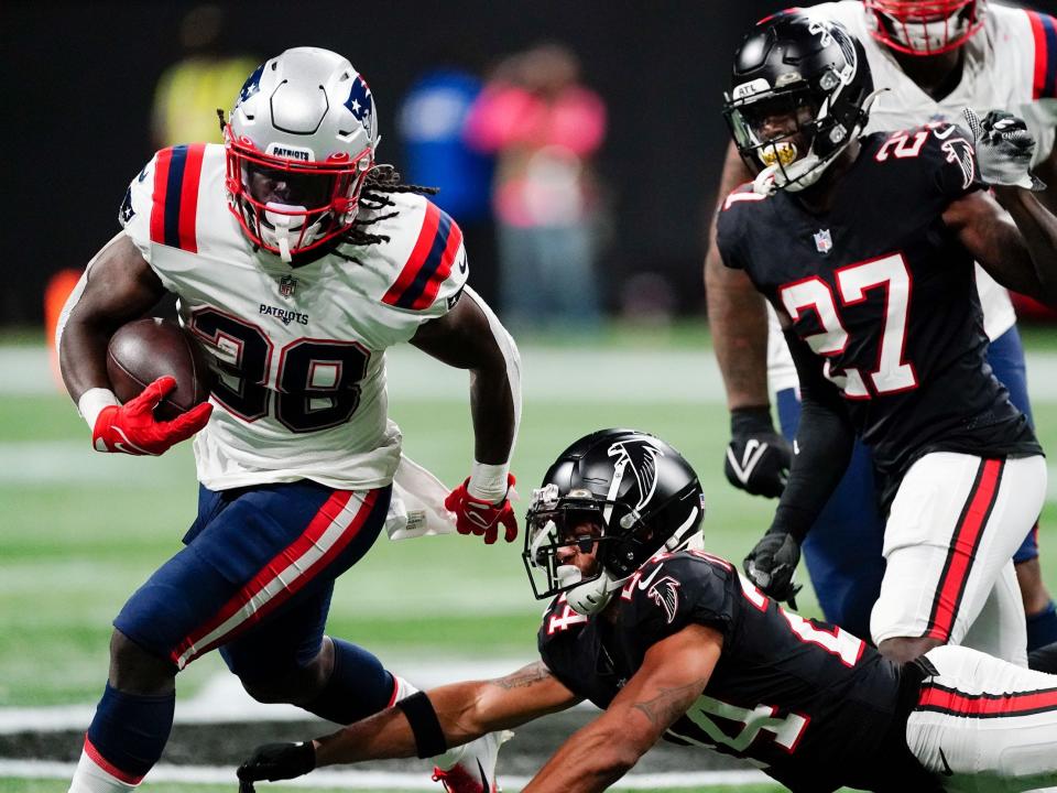 Rhamondre Stevenson makes a run against the Atlanta Falcons.