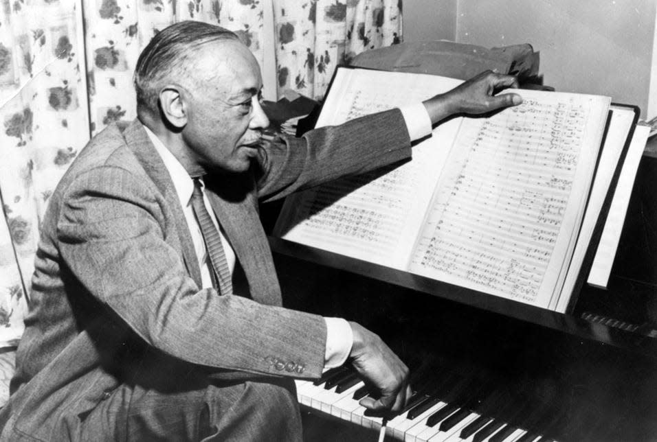 Composer William Grant Still poses at the piano in this undated photo.