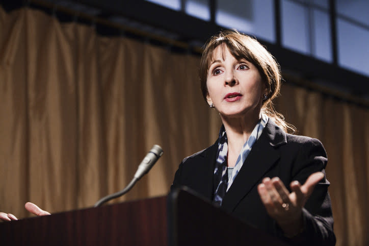 A woman giving a lecture