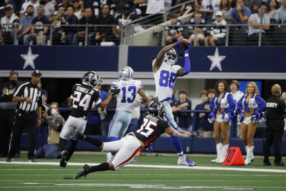 Dallas Cowboys wide receiver CeeDee Lamb (88) catches a pass as Atlanta Falcons cornerback Avery Williams (35) defends in the first half of an NFL football game in Arlington, Texas, Sunday, Nov. 14, 2021. (AP Photo/Michael Ainsworth)