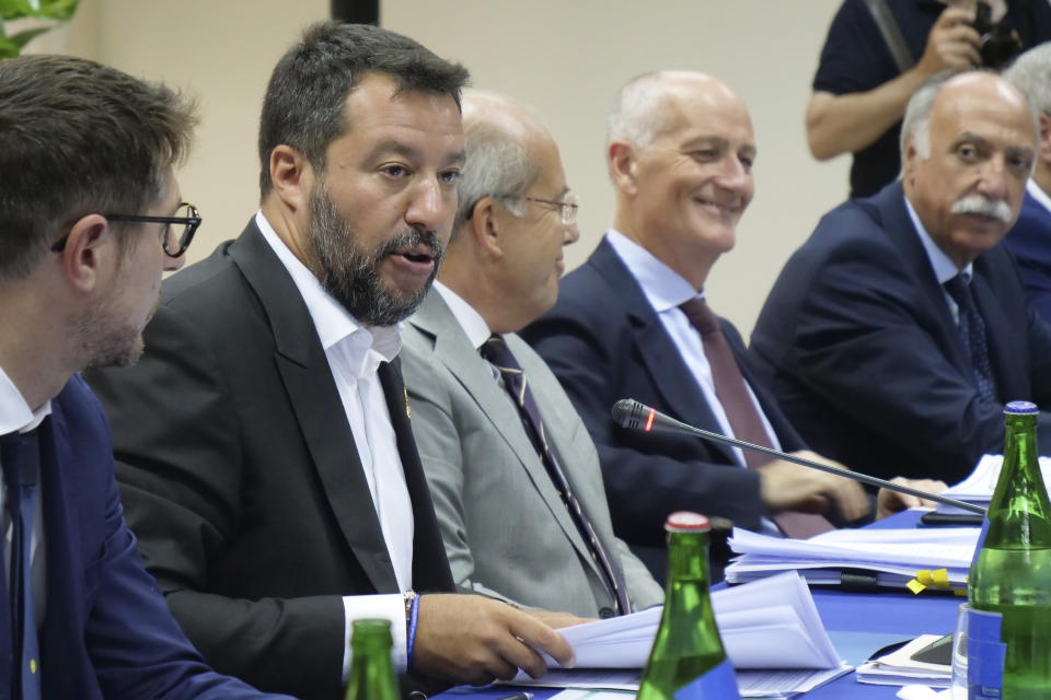 Italian Deputy Prime Minister and Interior Minister Matteo Salvini, second from left, holds a security conference in Castel Volturno, southern Italy, Thursday, Aug. 15, 2019. (AP Photo/Paolo Santalucia)