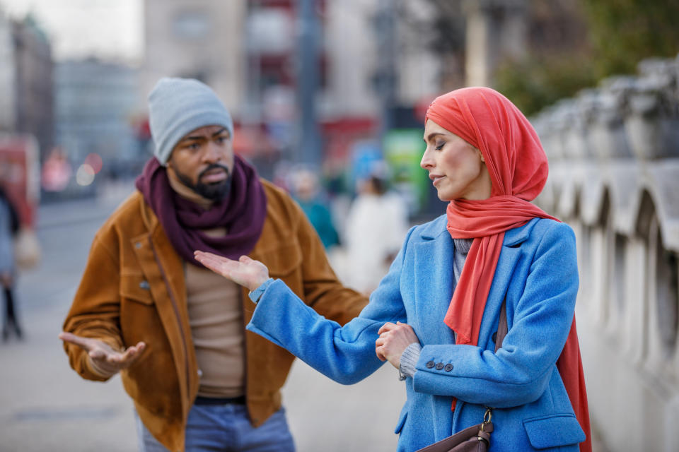 Couple arguing outside