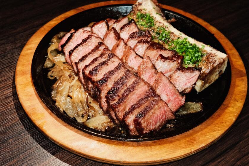 A photo of sliced zabuton steak with bone marrow on a skillet at Danbi restaurant in Koreatown.