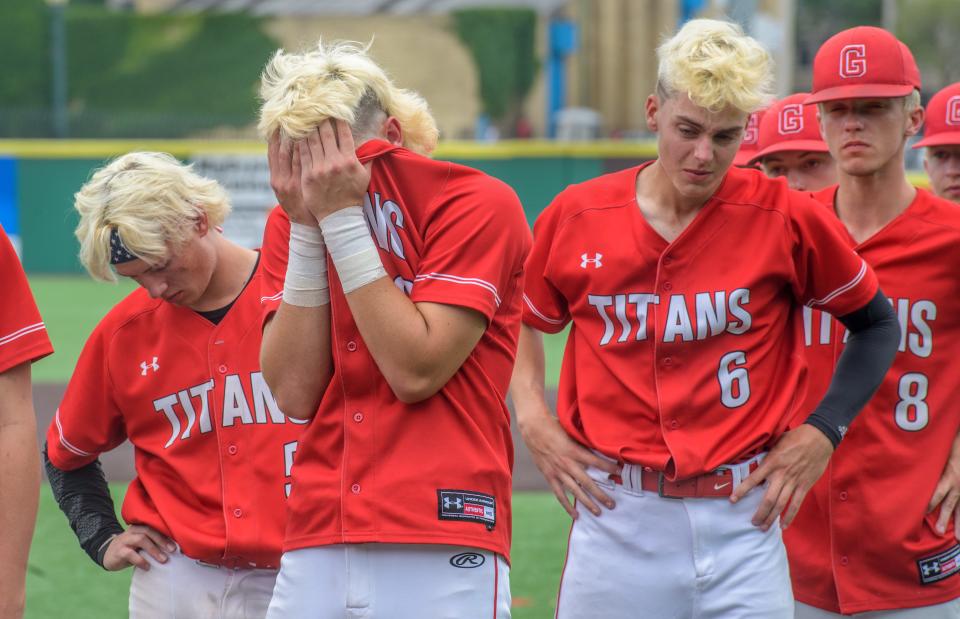 Chatham Glenwood's Garrett Rath, far left, Sam Hulvey, second from left, Eli Curtis (6) and Connor Roark try to contain their emotions after falling 5-1 to Nazareth Academy in the Class 3A state baseball title game Saturday, June 11, 2022 at Duly Health & Care Field in Joliet.