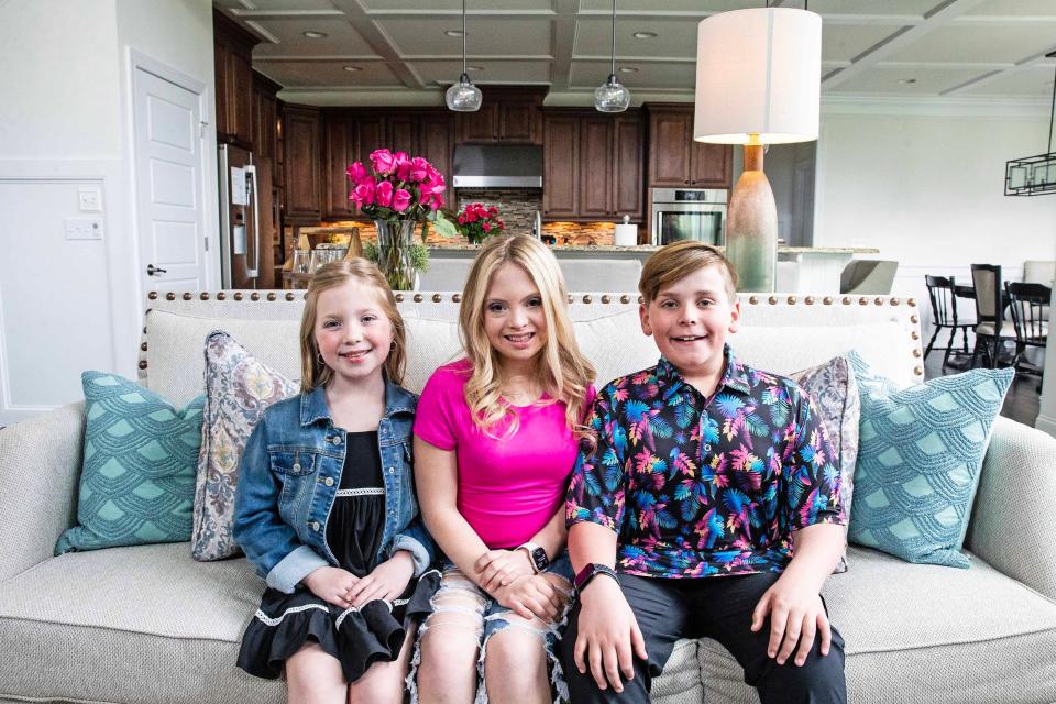 The Kosmalski siblings, from left, Brynnley, 7, Kayla,17, and Logan, 11, sit in the living room of their home in Middletown, Monday, March 18, 2024.