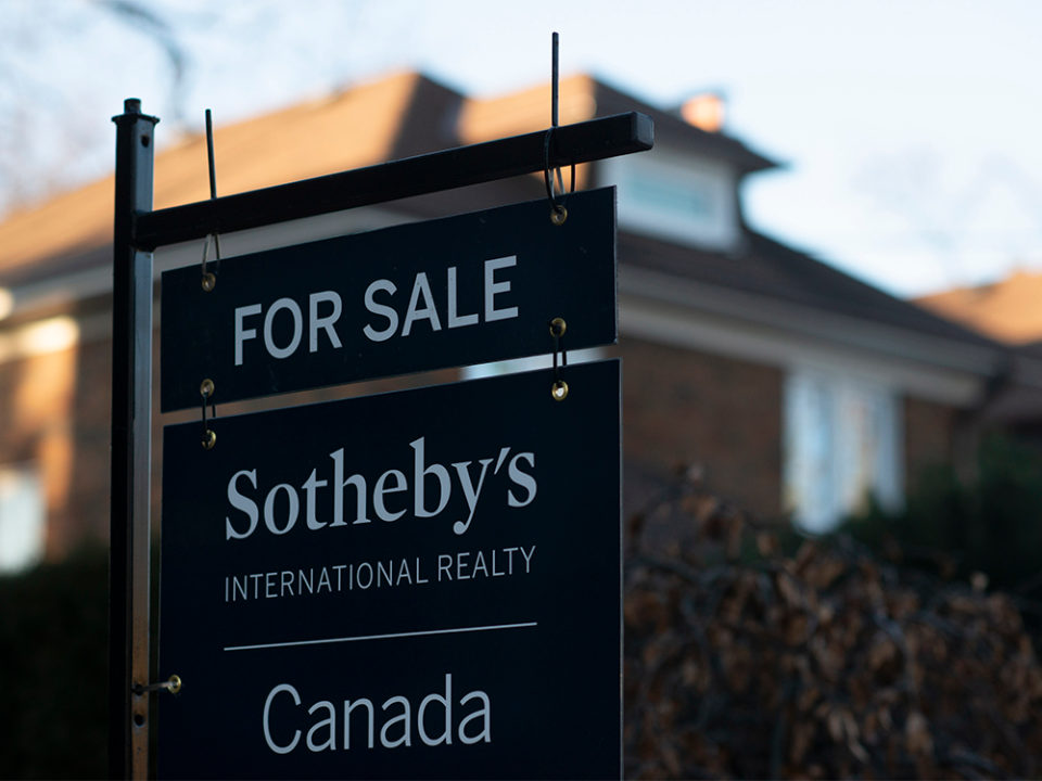  A real estate sale sign stands in front of a home in a west-end Toronto neighbourhood.