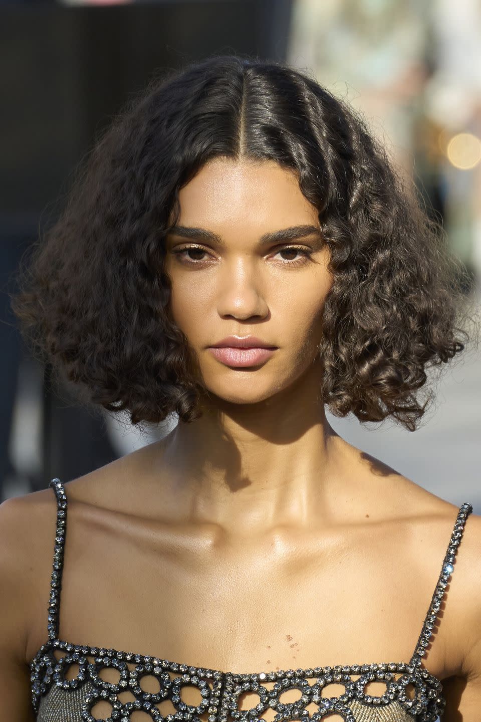 a woman with curly hair