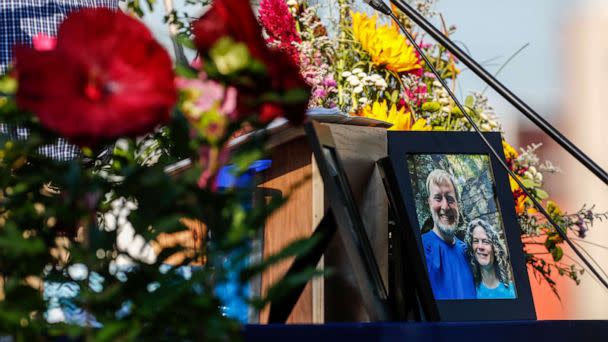 PHOTO: A photo of Tyler and Sarah Schmidt sits on the podium during the Celebration of Life event for Tyler, Sarah, and Lula Schmidt held at Overman Park, Aug. 2 2022 in Cedar Falls, Iowa. (Chris Zoeller/The Courier via AP)