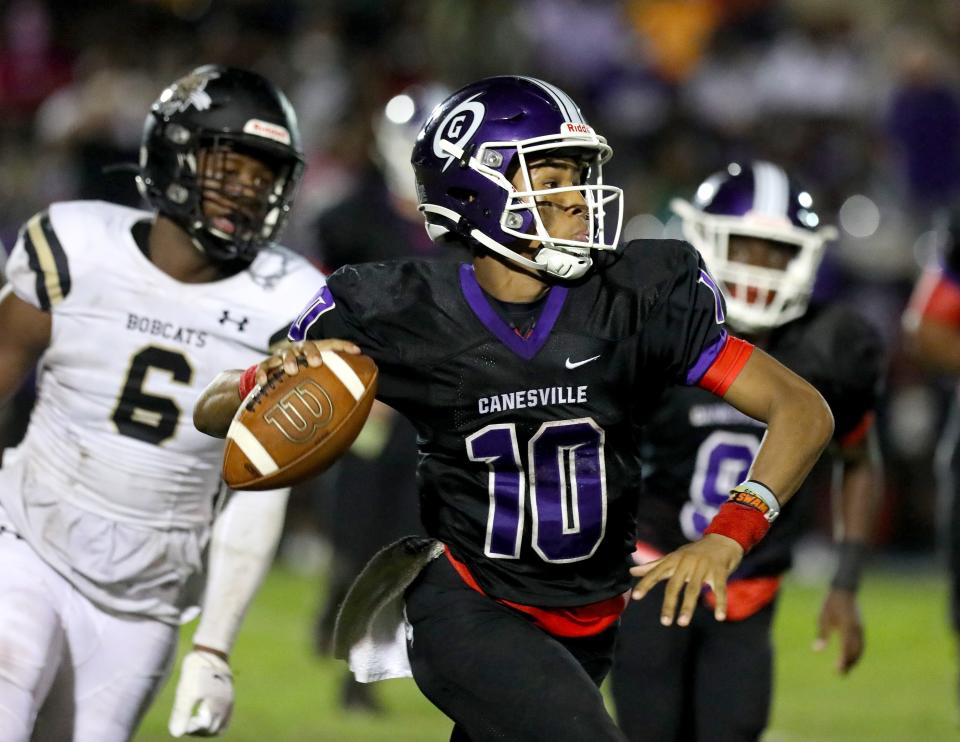 Shooby Coleman (10) looks downfield for a receiver to throw the ball to during a football game between the rival Gainesville Purple Hurricanes and the Buchholz Bobcats, at Citizens Field in Gainesville Fla. October 7, 2021. Coleman transferred to Williston during the offseason.