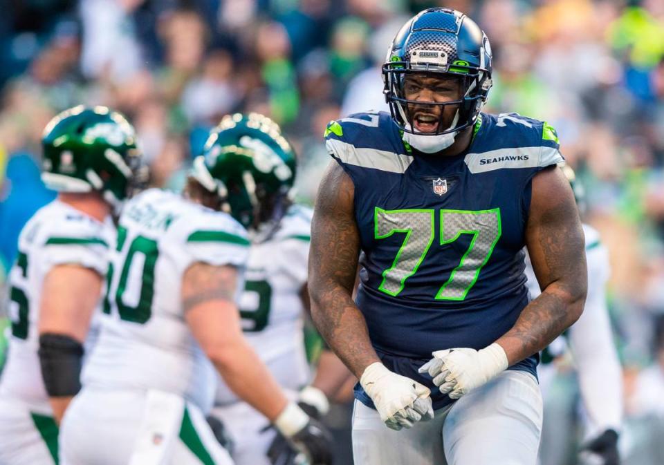 Seattle Seahawks defensive tackle Quinton Jefferson (77) celebrates after making a tackle in the fourth quarter of an NFL game against the New York Jets at Lumen Field in Seattle Wash. on Jan. 1, 2023. The Seahawks defeated the Jets 23-6.