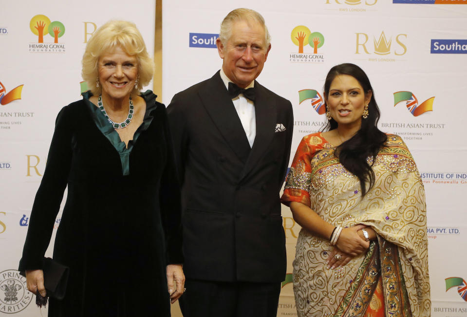 The Prince of Wales and the Duchess of Cornwall with International Development Secretary Priti Patel (right) during a reception and dinner for supporters of the British Asian Trust at Guildhall, London.