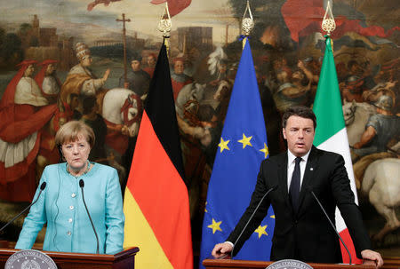 Italian Prime Minister Matteo Renzi (R) speaks next to German Chancellor Angela Merkel as they lead a news conference at Chigi palace in Rome, Italy May 5, 2016. REUTERS/Max Rossi