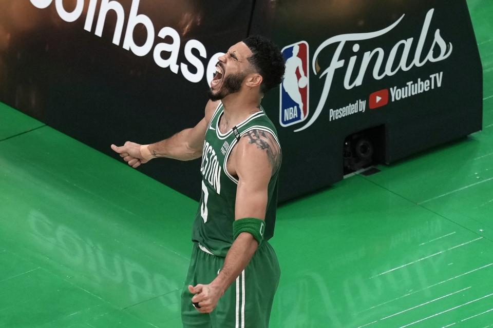 Boston Celtics' Jayson Tatum celebrates after scoring during the first half of Game 5 of the NBA basketball finals against the Dallas Mavericks, Monday, June 17, 2024, in Boston. (AP Photo/Michael Dwyer)