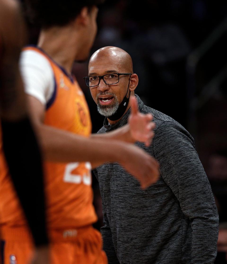 Phoenix Suns' head coach Monty Williams gives instructions to Cam Johnson (23) during the first half of an NBA basketball game against the New York Knicks Friday, Nov. 26, 2021, in New York. AP Photo/John Munson).