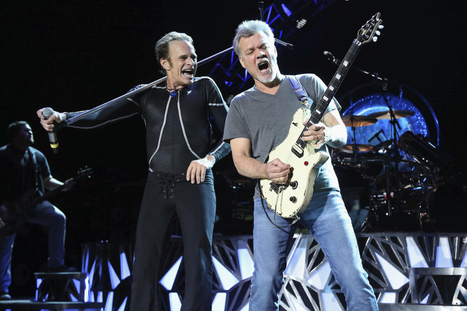 FILE - David Lee Roth, left, and Eddie Van Halen of Van Halen perform in Wantagh, N.Y. on Aug. 13, 2015. Van Halen, who had battled cancer, died Tuesday, Oct. 6, 2020. He was 65. (Photo by Greg Allen/Invision/AP, File)