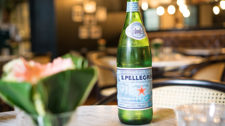 bottle of pellegrino on restaurant table