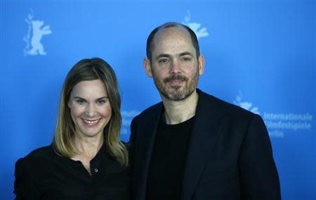 Cast member Nele Mueller-Stofen and director Edward Berger smile during a photocall to promote the movie "Jack" during the 64th Berlinale International Film Festival in Berlin February 7, 2014. REUTERS/Thomas Peter