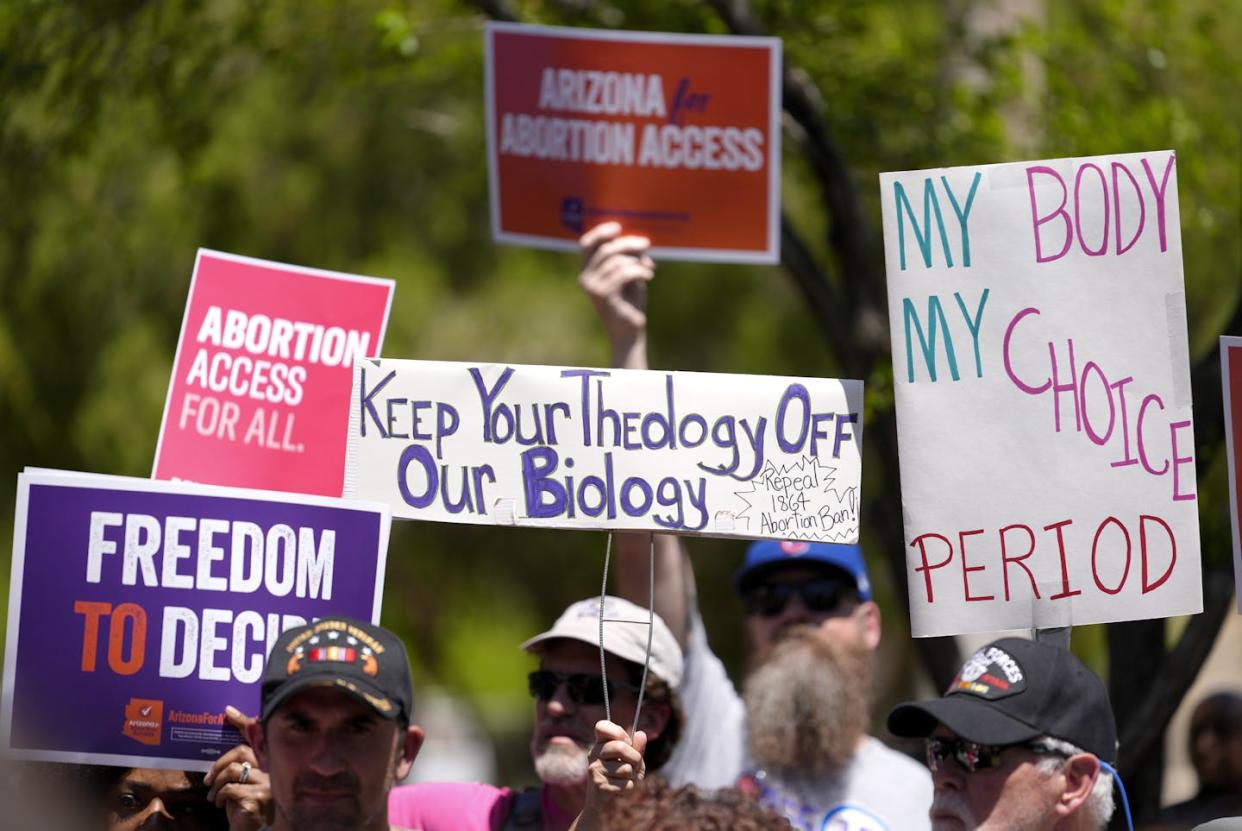 Abortion rights supporters gather outside the Arizona Capitol building in Phoenix. <a href="https://newsroom.ap.org/detail/AbortionArizona/6a140e4f3aa341dfa3088c0e8dcca40d/photo?Query=arizona%20abortion&mediaType=photo&sortBy=&dateRange=Anytime&totalCount=5&digitizationType=Digitized&currentItemNo=1&vs=true" rel="nofollow noopener" target="_blank" data-ylk="slk:AP Photo/Matt York;elm:context_link;itc:0;sec:content-canvas" class="link ">AP Photo/Matt York</a>