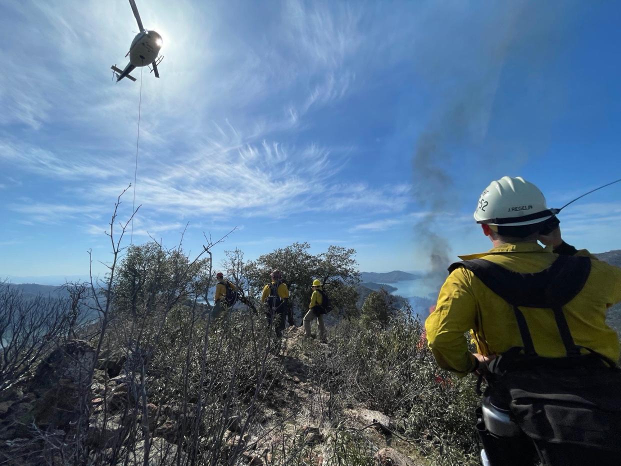 Firefighters conduct controlled burns in the Shasta-Trinity National Forest on April 16, 2023.