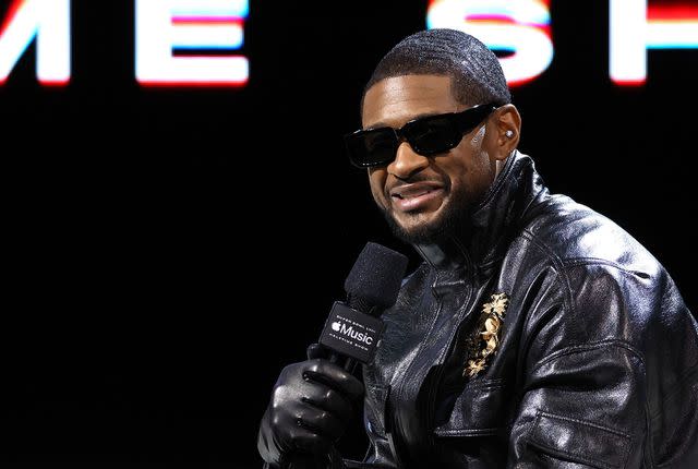 <p>Kevin Mazur/Getty</p> Usher speaks during the Super Bowl LVIII Pregame & Apple Music Super Bowl LVIII Halftime Show press conference at the Mandalay Bay Convention Center on Feb. 8, 2024 in Las Vegas